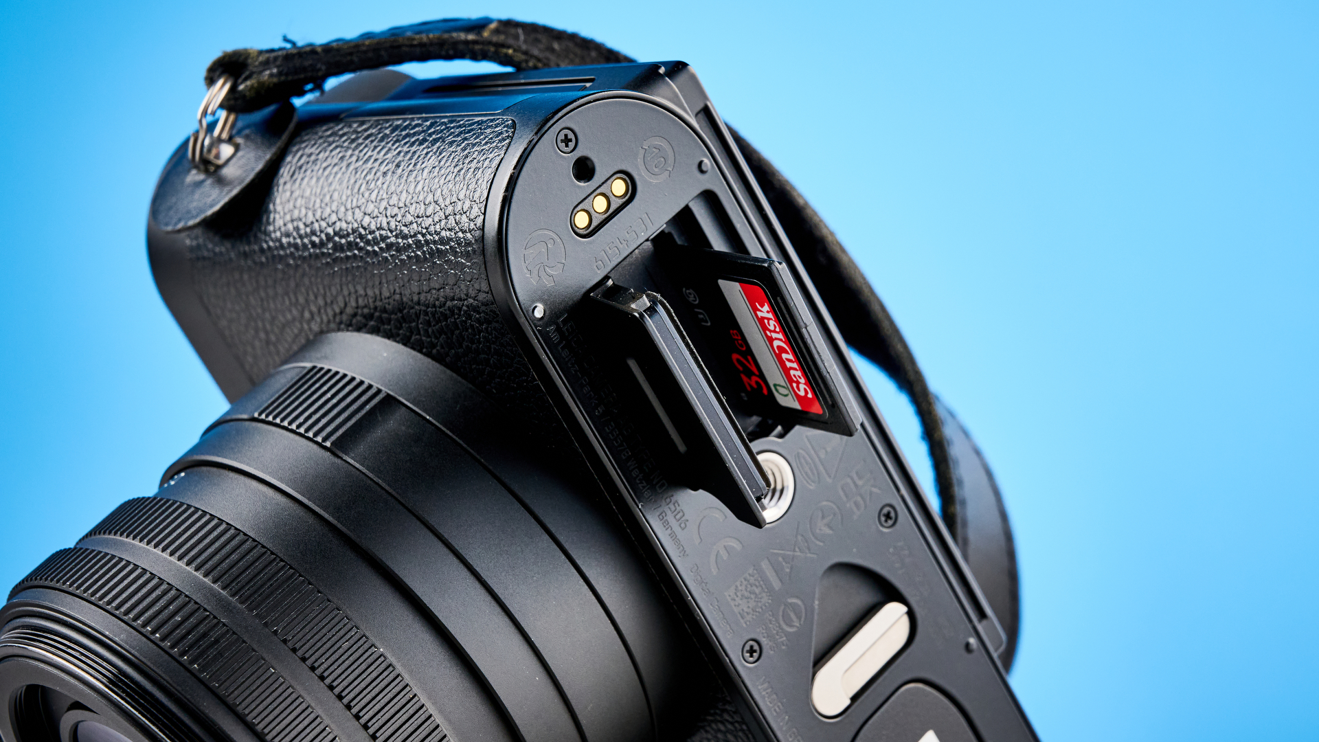 A black Leica Q3 Monochrom black-and-white mirrorless camera