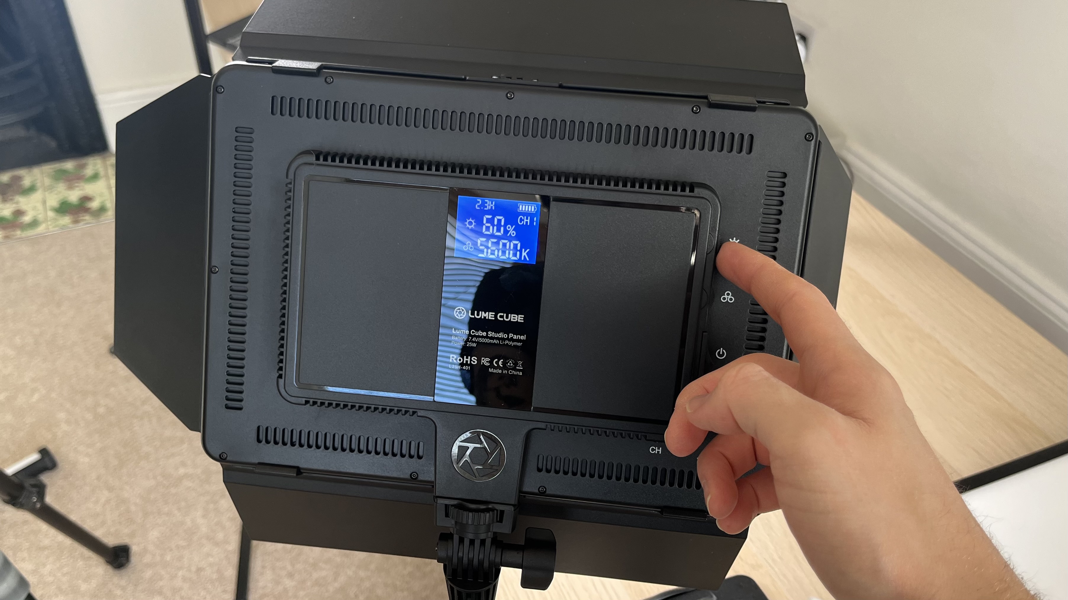 Lume Cube Studio Panel Lighting Kit, light panel rear with hand in frame