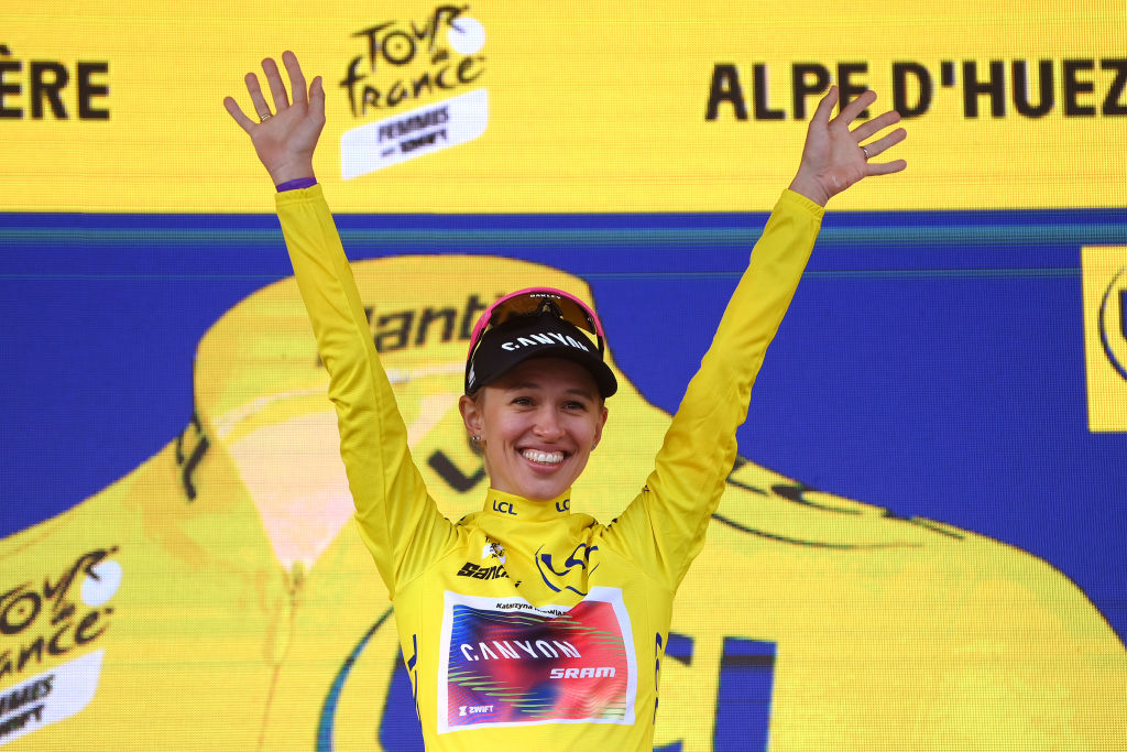 of Poland and Team CanyonSRAM Racing Yellow Leader Jersey celebrates at podium as final overall race winner during the 3rd Tour de France Femmes 2024 Stage 8 a 1499km stage from Le GrandBornand to Alpe dHuez 1828m UCIWWT on August 18 2024 in Alpe dHuez France Photo by Alex BroadwayGetty Images