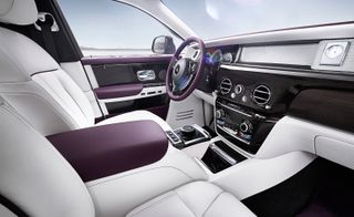 The cabin of the Rolls-Royce Phantom is swathed in a traditional mix of leather, wood and chrome