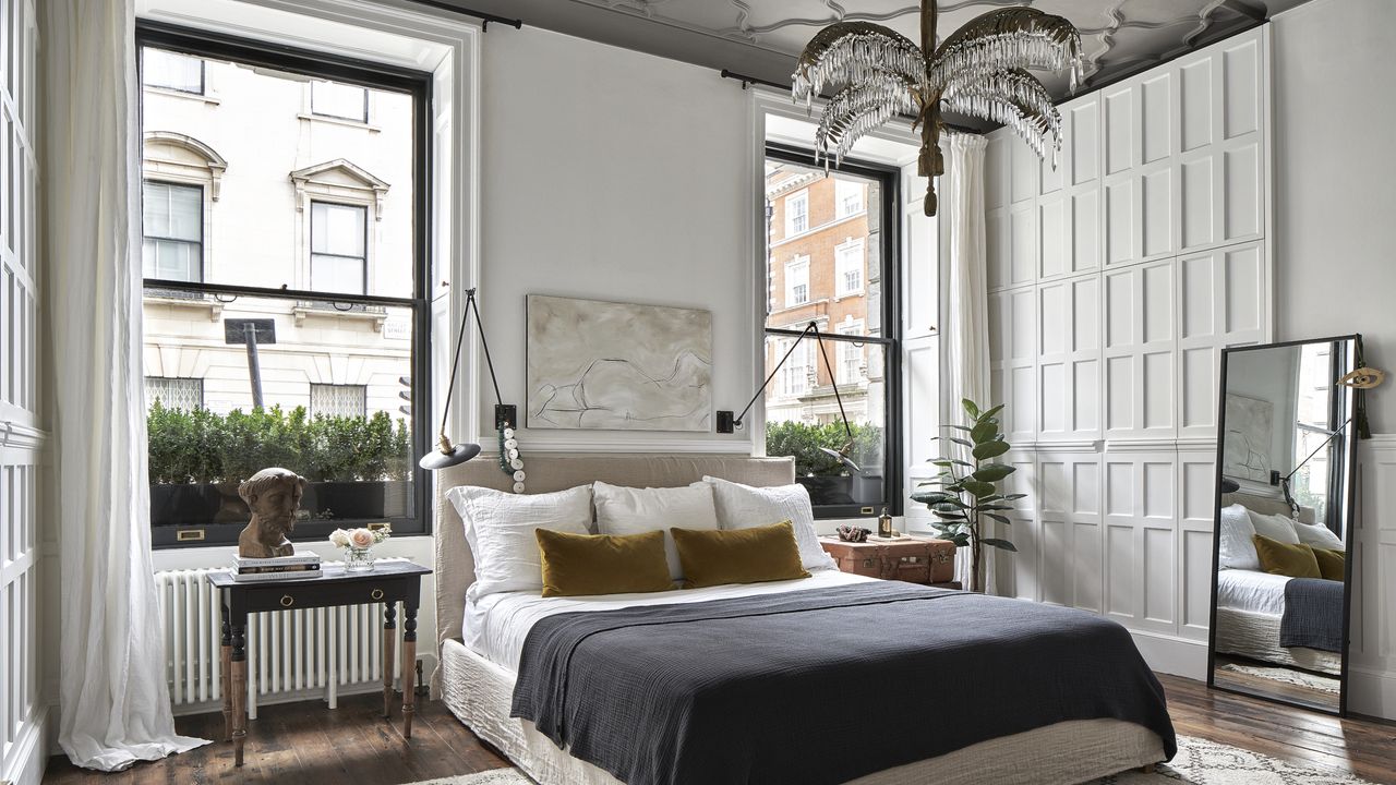 a bedroom with a hidden closet door in paneling