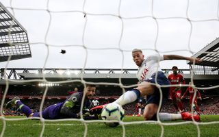 Toby Alderweireld, right, scores an unlucky own goal to hand Liverpool victory