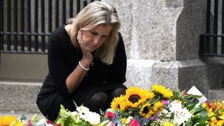 Sophie, Countess of Wessex looks messages and floral tributes left by members of the public