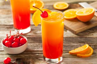 Juicy Orange and Red Tequila Sunrise with a Cherry
