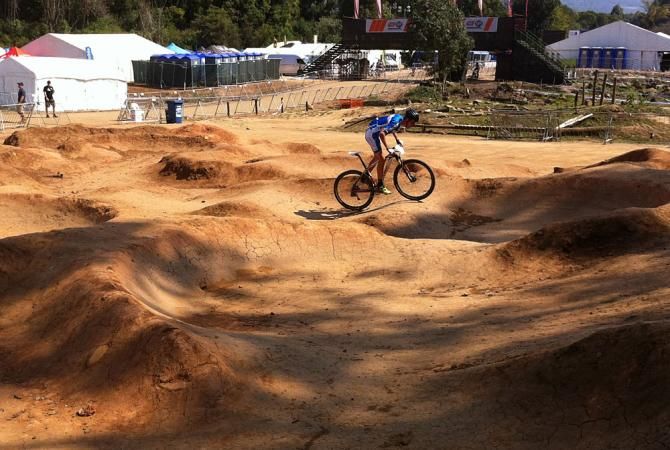 An Italian rider plays on the pump track.