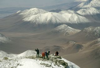 In this 1999 photo, members of Johan Reinhard's expedition dig for mummies atop Mount Llullaillaco.