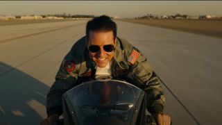 Tom Cruise as Maverick riding a motorcycle