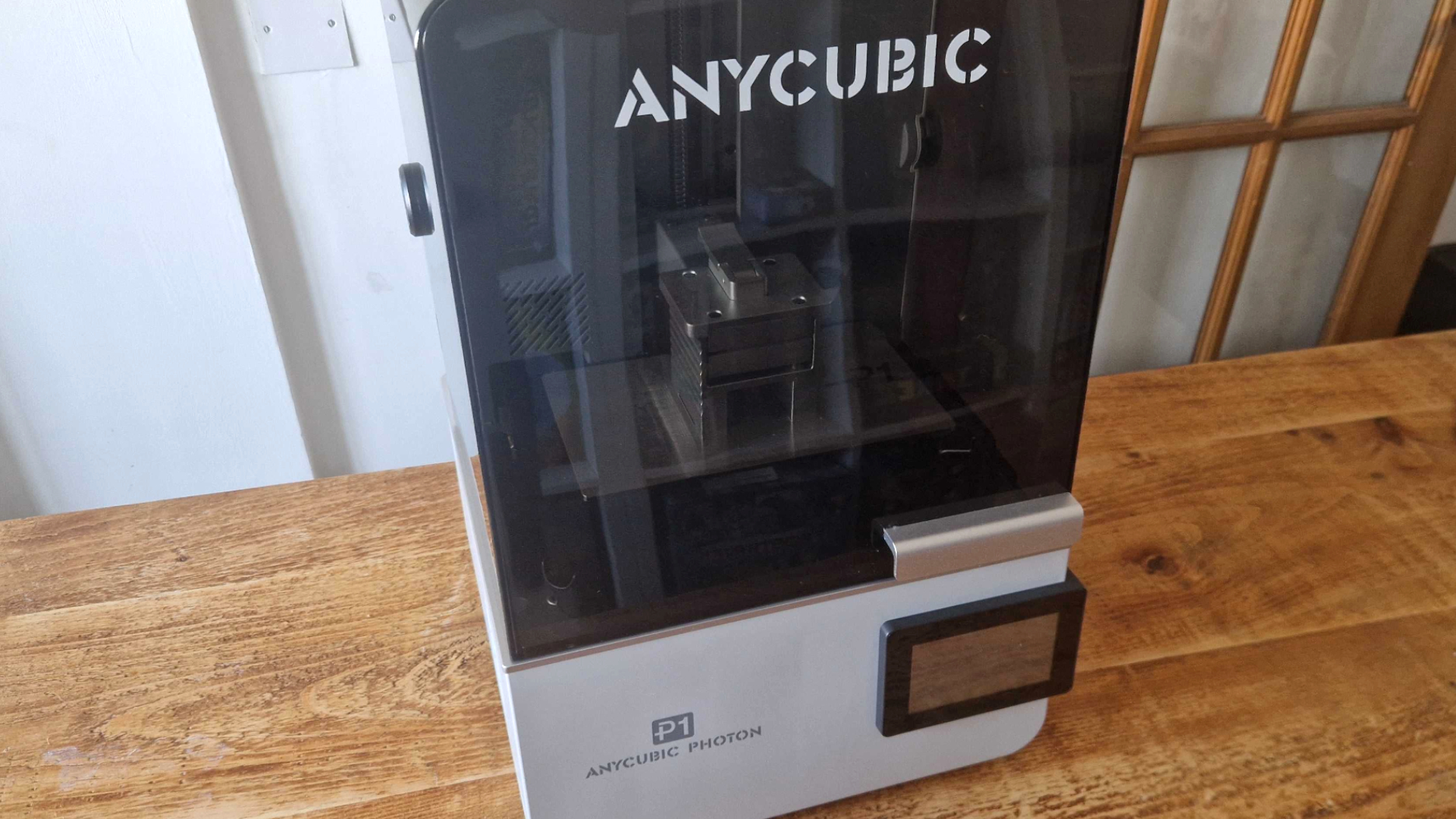 Anycubic Photon P1 sat on a wooden table