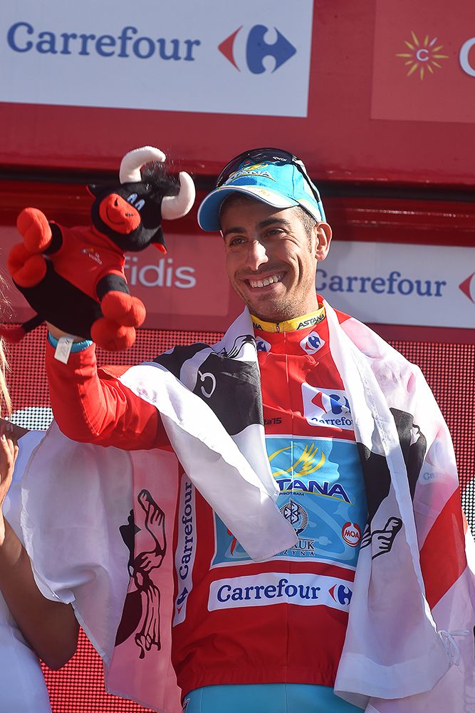 Fabio Aru celebrates on the stage 20 podium.