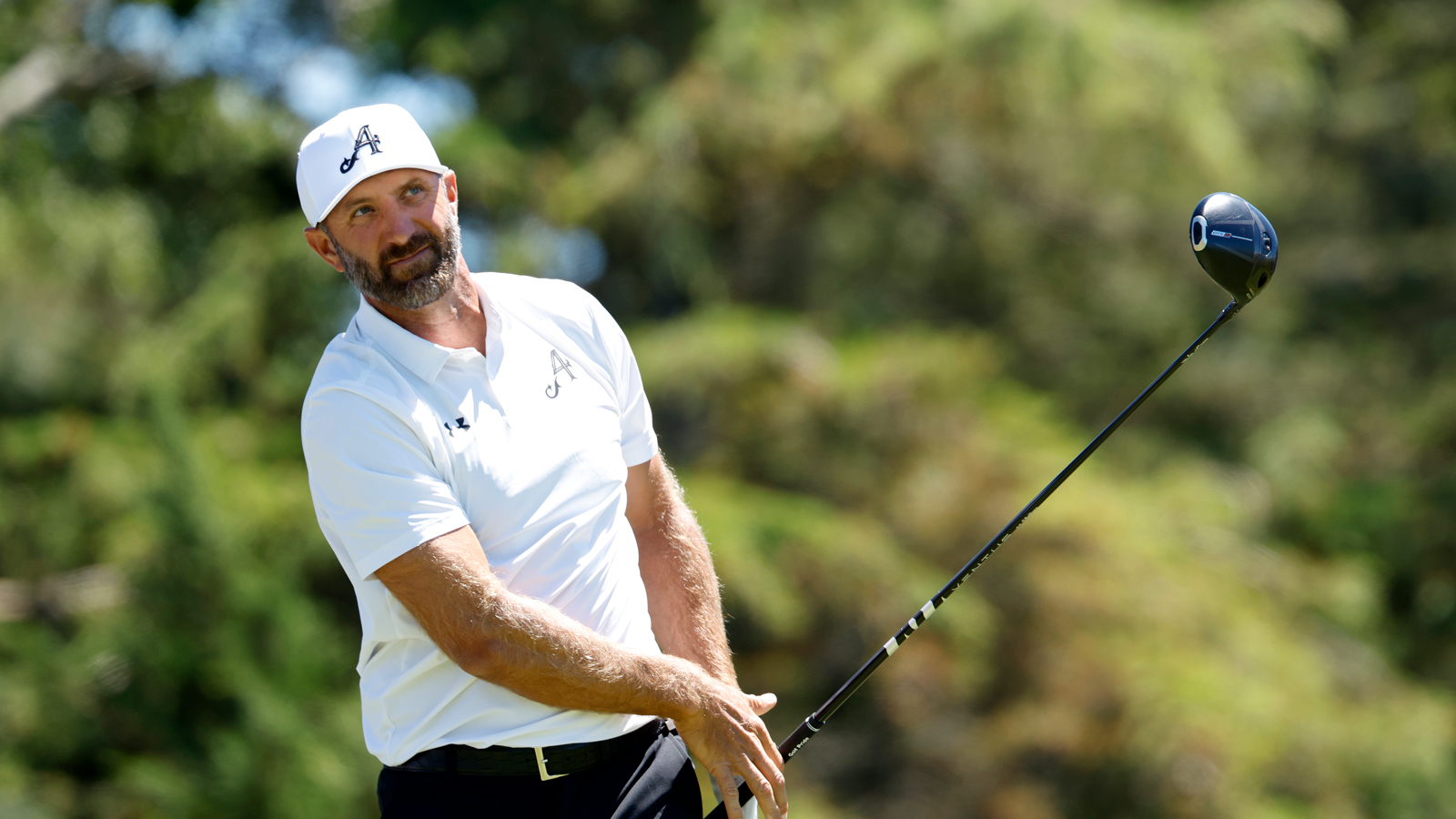 Dustin Johnson hits a driver off the tee