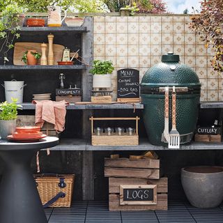 outdoor kitchen with grey shelf and plants