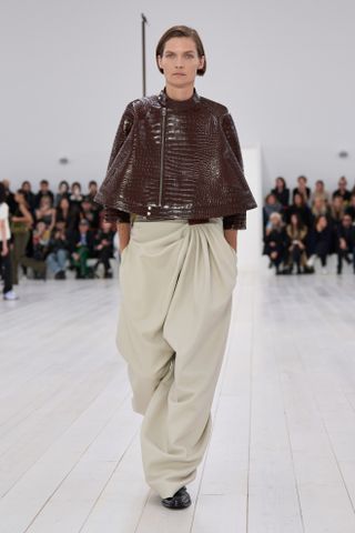 Photo of model walking in Mocha Mousse colorway in Loewe Fall-Winter 2025 show