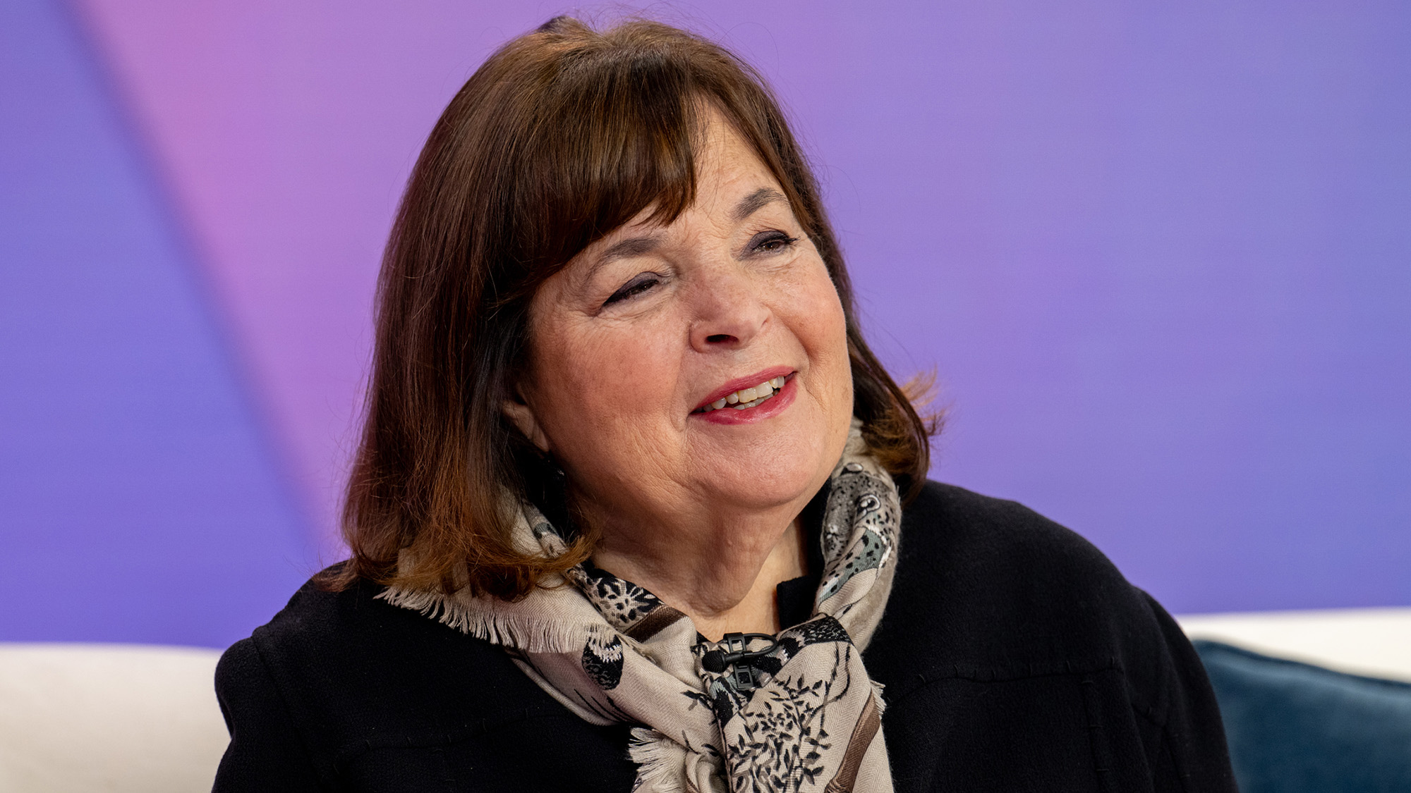 Ina Garten in front of purple background