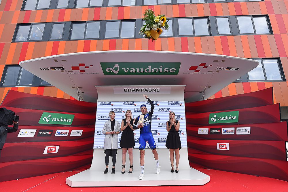Maximiliano Richeze lets his bouquet fly after stage 4 at Tour de Suisse.