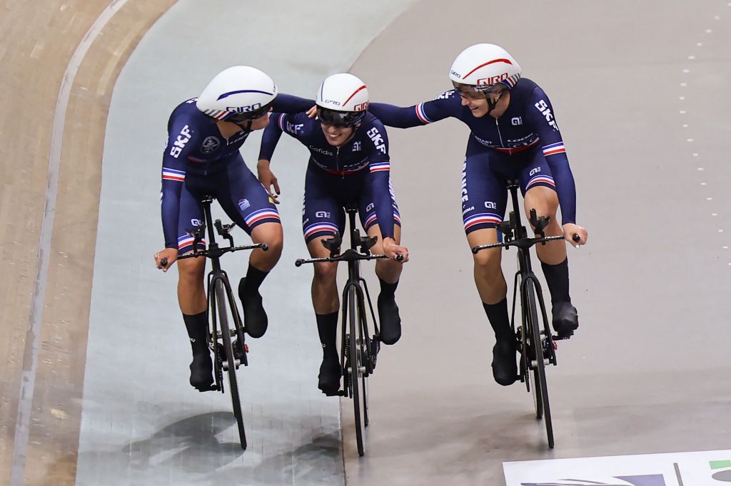 French team riders Frances Victoire Berteau Frances Marion Borras and Frances Valentine Fortin celebrate taking third place bronze medal in the Womens Team Pursuit finals during the UCI Track Cycling World Championships at the Velodrome of SaintQuentinenYvelines southwest of Paris on October 13 2022 Photo by Thomas SAMSON AFP Photo by THOMAS SAMSONAFP via Getty Images