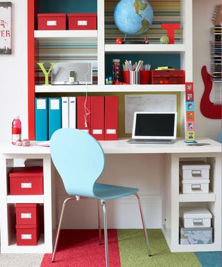 children room with desk and open shelve