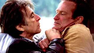 Al Pacino as Will Dormer pushing Robin Williams as Walter Finch against a wall in the thriller movie Insomnia.