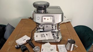 Breville Barista Touch Impress unboxed beside components