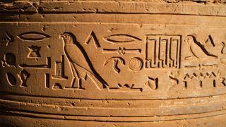 Sand stone carving of egyptian god and goddess at Temple of kom ombo locate at North aswan city Egypt.