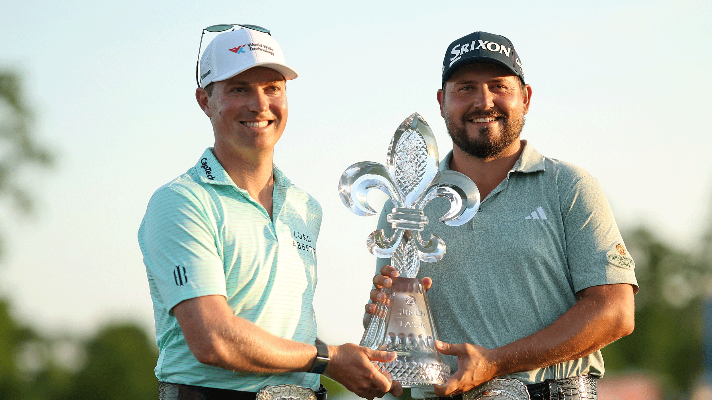 Ben Griffin and Andrew Novak pose with the Zurich Classic of New Orleans trophy following their win in 2025