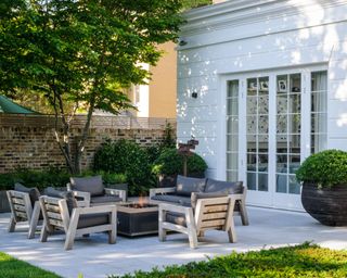 garden terrace with furniture and oversized pots