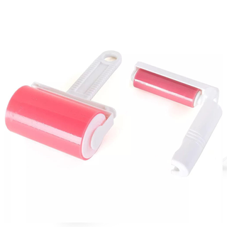  A pair of sticky reusable pink and white lint rollers