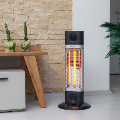 infrared heater on grey floor next to table