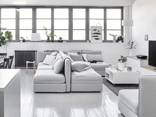 Grey minimalist loft apartment living room with sectional sofa