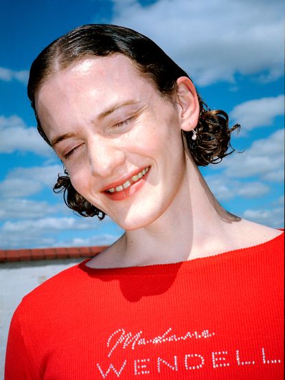 Red top with open back in a heart shape.