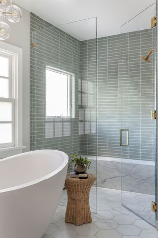 sage green bathroom with horizontal stacked tiles by Banner Day Interiors