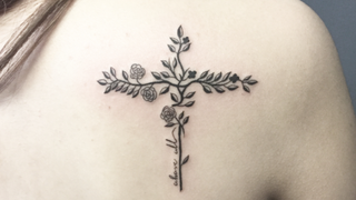 Botanical cross tattoo