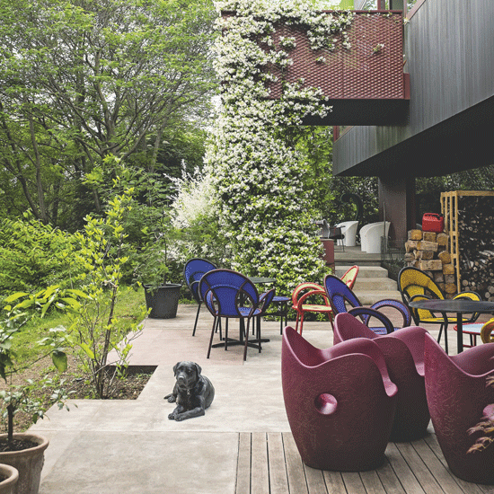outdoor balcony with chairs and garden
