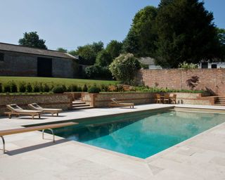 pool patio featuring paving from artisans of devizes
