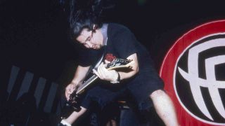 Fear Factory’s Dino Cazares performing onstage in 1995