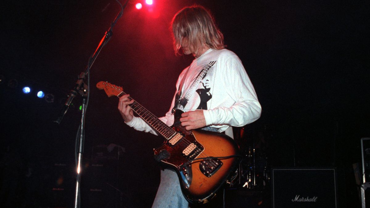 Kurt Cobain of Nirvana performs on stage at the Astoria Theatre, London, 5th November 1991. He is playing a Fender Jaguar guitar.