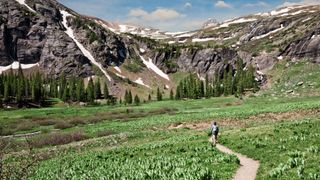 Woman Hiking to Upper Ice Lakes Basin