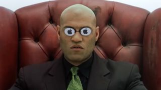 Morpheus, sitting in &quot;the volume&quot; in The Matrix, with Apple logos reflected in his sunglasses