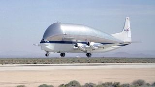 NASA's outsized SGT Super Guppy-Turbine transport aircraft lifts off the runway at Edwards Air Force Base after a prior visit.