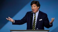 Tucker Carlson speaks on stage at the Republican National Convention on July 18, 2024