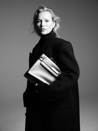 Kate Moss in Saint Laurent's Fall 2023 campaign carrying a Manhattan bag.