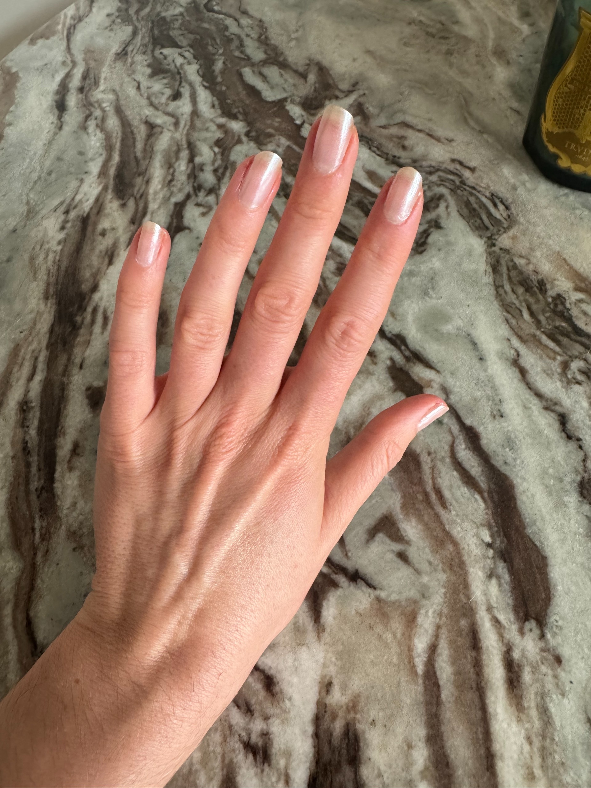 Beauty editor Eleanor Vousden testing Manucurist White Glazed Powder on her nails