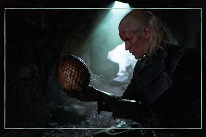 a still of Matt Smith holding a dragon's egg in House of the Dragon