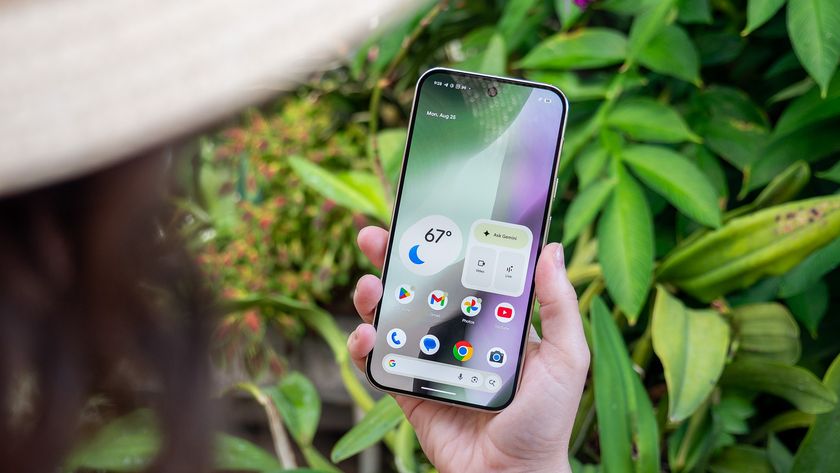 Holding a Google Pixel 10 Pro XL while looking at the homescreen with weather and Gemini widgets on it