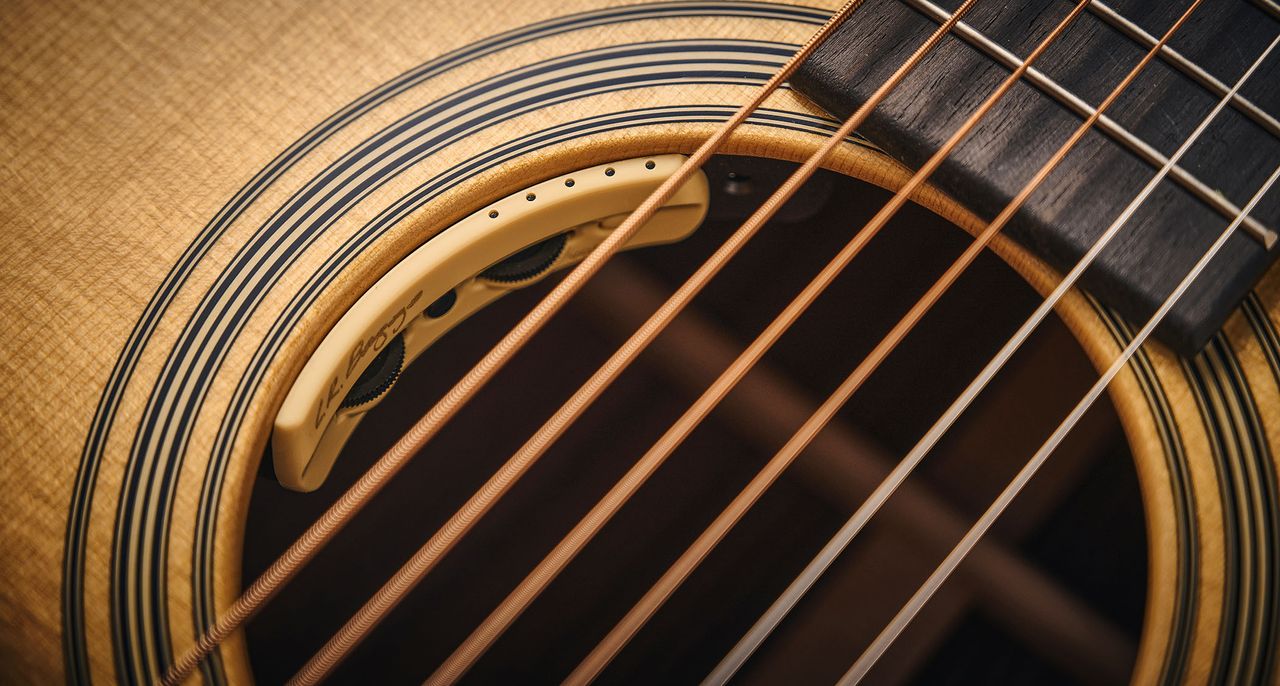 Martin OM-28E with L.R. Baggs Anthem is a stunning update on a classic acoustic, with top-class electronics. Here it is photographed in close-up and against a door with a distressed blue paint-job.