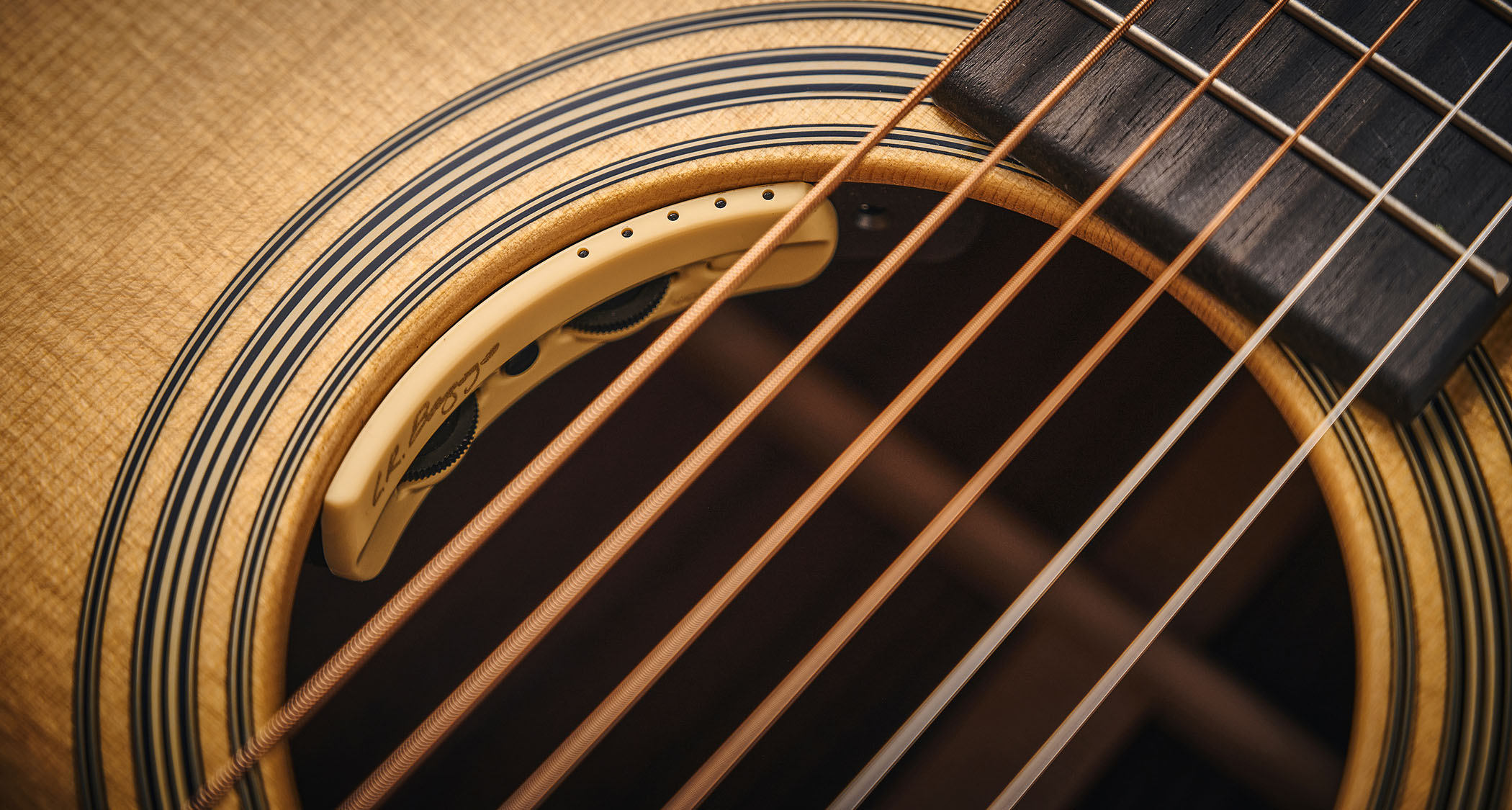 Martin OM-28E with L.R. Baggs Anthem is a stunning update on a classic acoustic, with top-class electronics. Here it is photographed in close-up and against a door with a distressed blue paint-job.