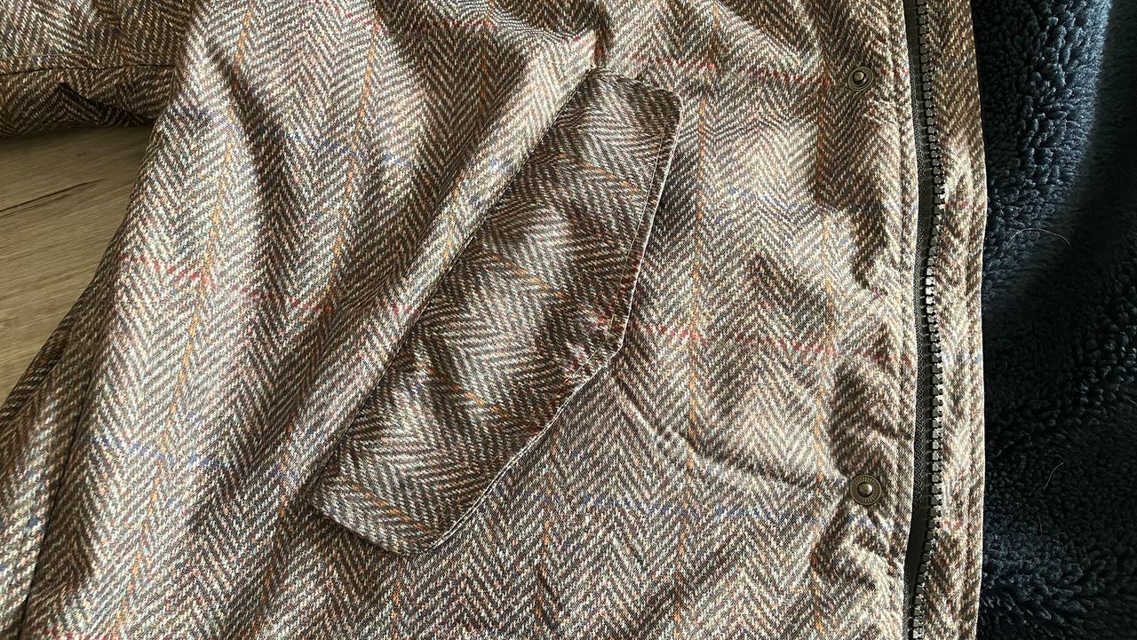 Hestt Eco-Ultra riding robe close up view of storm flap over pocket