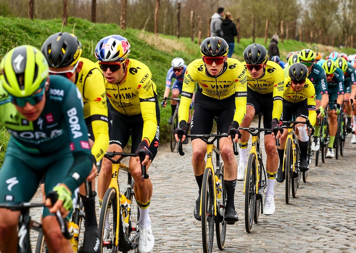 Belgian Tiesj Benoot of Team Visma-Lease a Bike (2L), Belgian Wout Van Aert of Team Visma-Lease a Bike (3L) and US Matteo Jorgenson of Team Visma-Lease a Bike (C) compete in the men elite &#039;Dwars Door Vlaanderen&#039; cycling race, 188,6 km from Roeselare to Waregem, on March 27, 2024. (Photo by DAVID PINTENS / Belga / AFP) / Belgium OUT