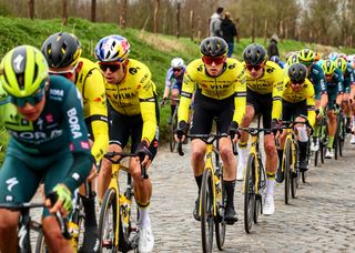 Belgian Tiesj Benoot of Team Visma-Lease a Bike (2L), Belgian Wout Van Aert of Team Visma-Lease a Bike (3L) and US Matteo Jorgenson of Team Visma-Lease a Bike (C) compete in the men elite 'Dwars Door Vlaanderen' cycling race, 188,6 km from Roeselare to Waregem, on March 27, 2024. (Photo by DAVID PINTENS / Belga / AFP) / Belgium OUT