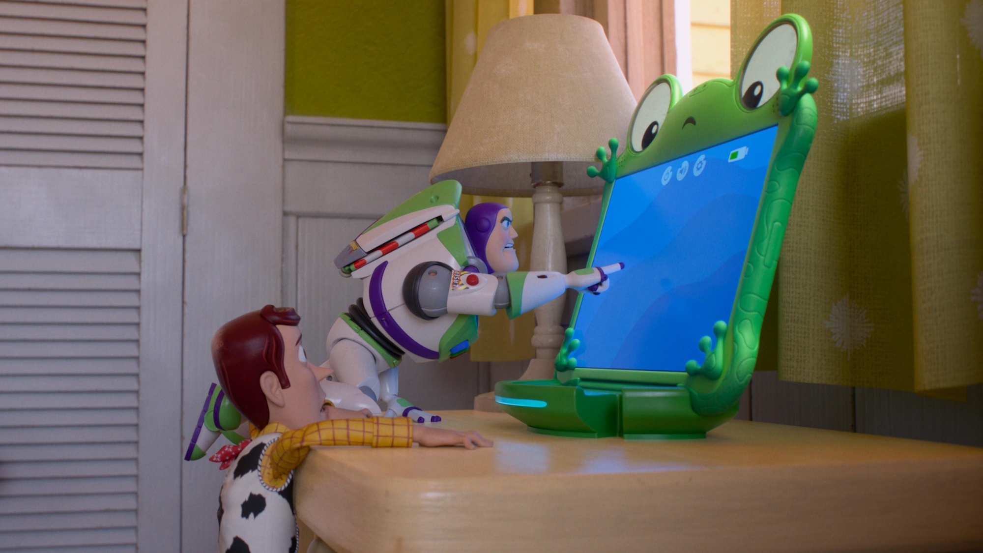Woody and Buzz Lightyear looking at Lilypad tablet