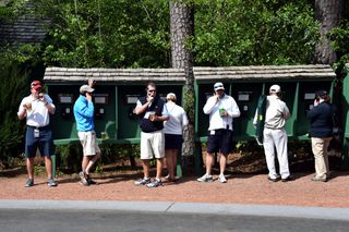Patrons use the pay phones at The Masters